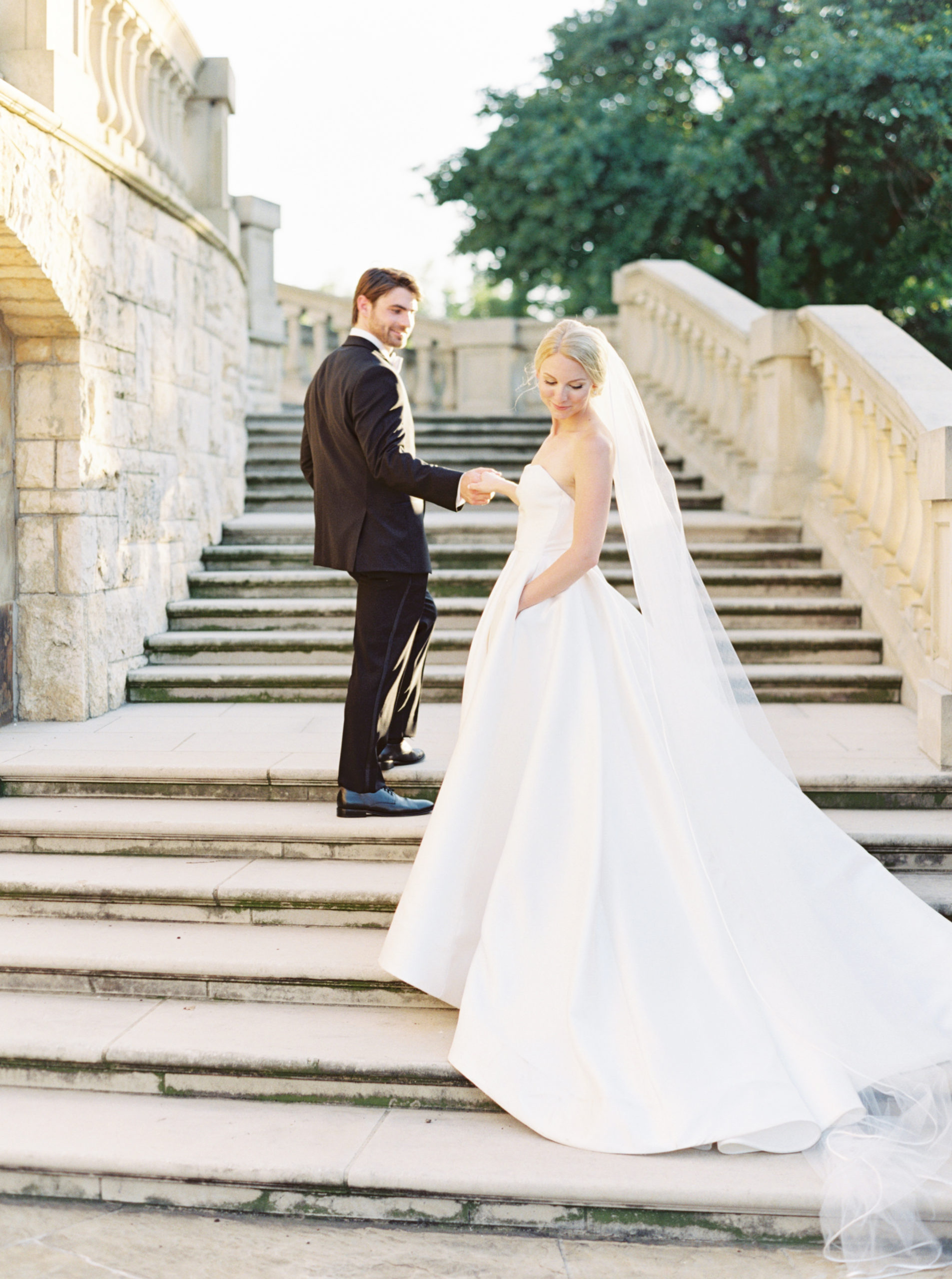Bride and groom pose at the stairs at The Olana during their wedding shoot taken by Mackenzie Reiter