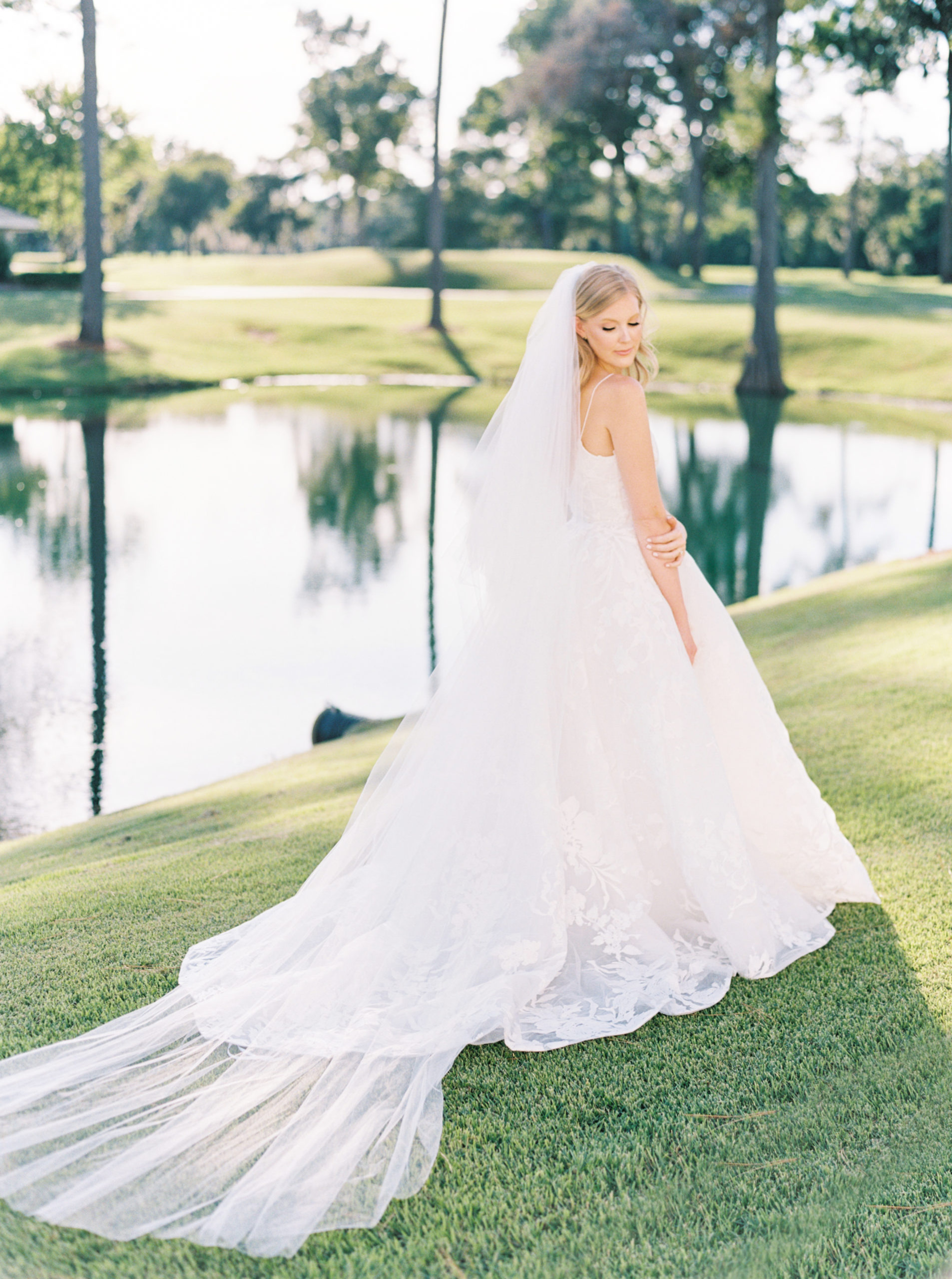 Elegant bride posing at the the pristine and manicured golf course at the Lakeside Country Club