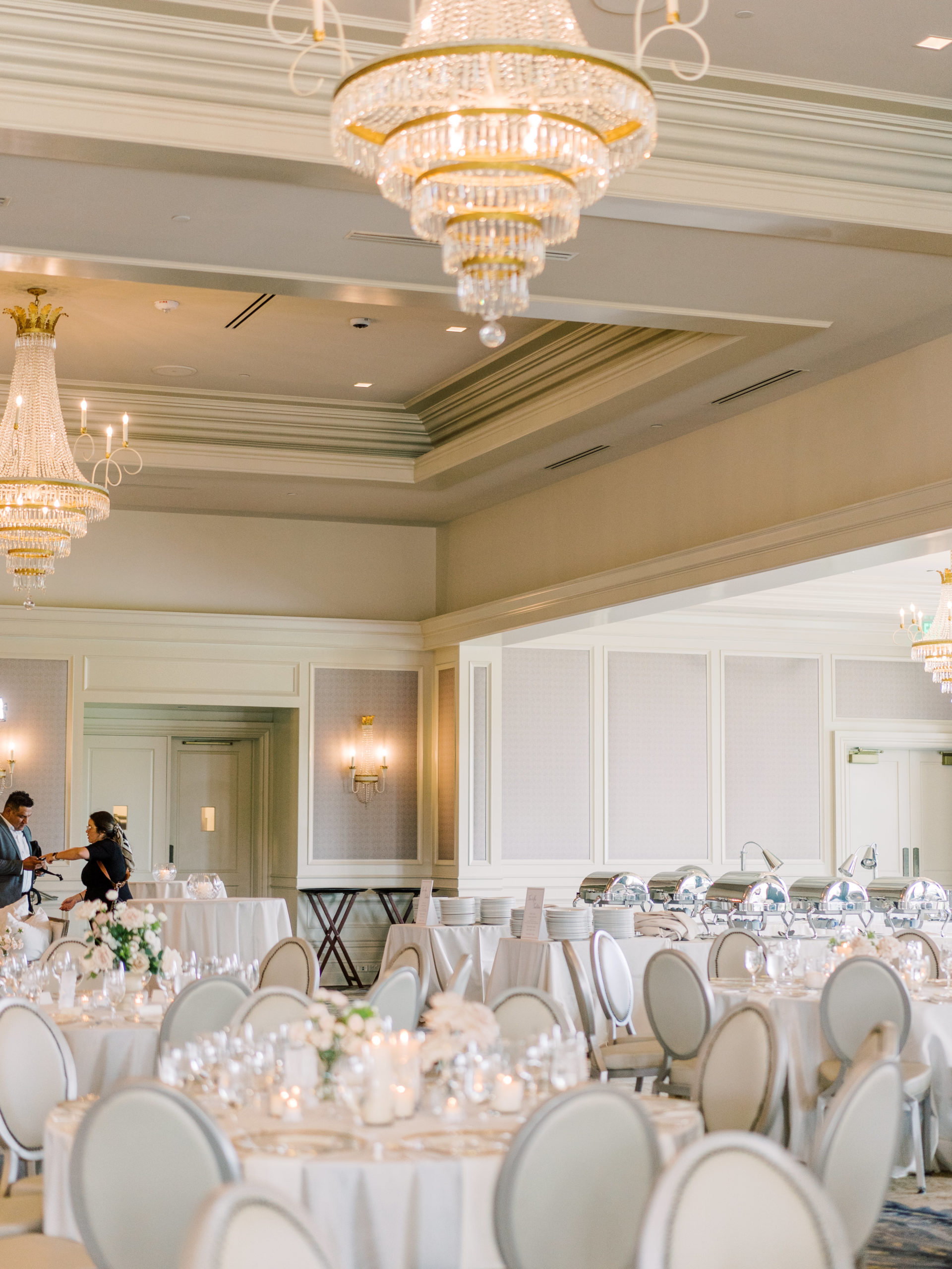 Grand Ballroom can seat up 600 people, with chandeliers on the ceiling and tables set up for a wedding reception